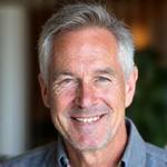 Portrait of Mark, a contented man in his early 50s.
