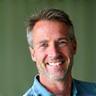 Headshot of Mark Thompson, a friendly and experienced male fitness coach.
